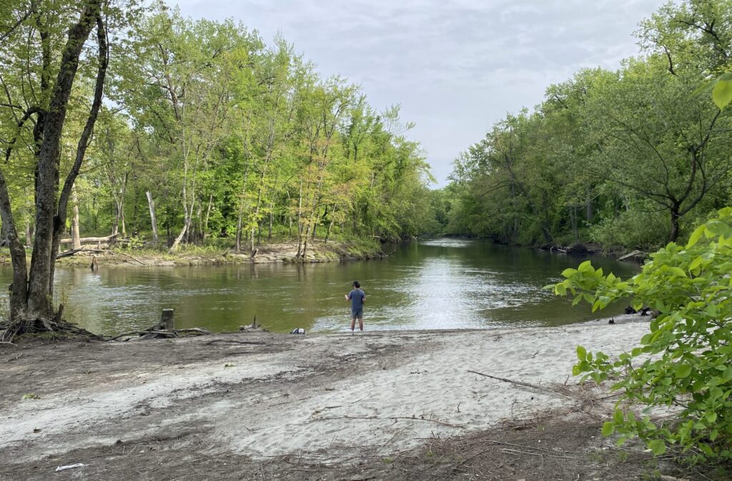 man fishing on the connecticut river near vernon vt